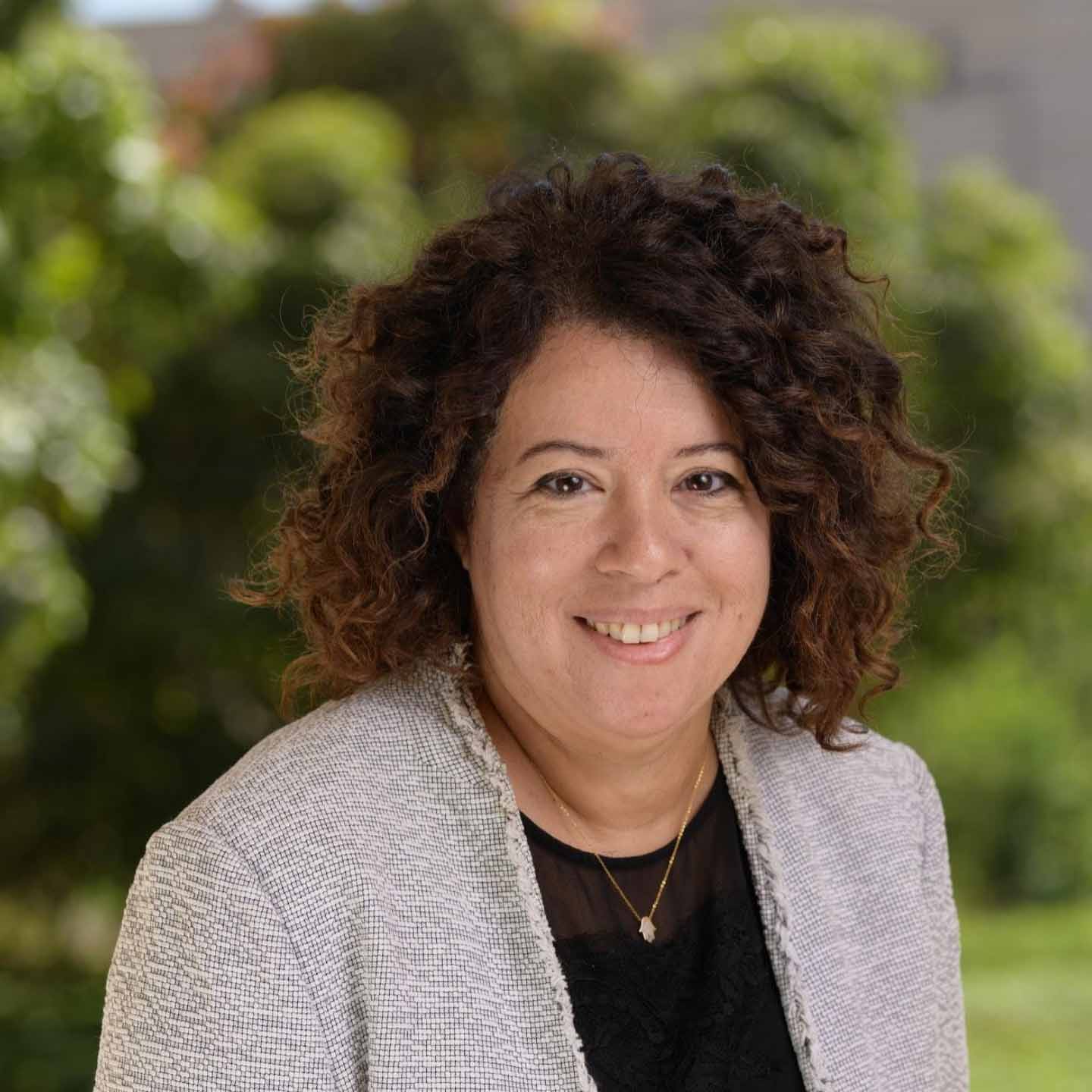 a woman with brown curly hari