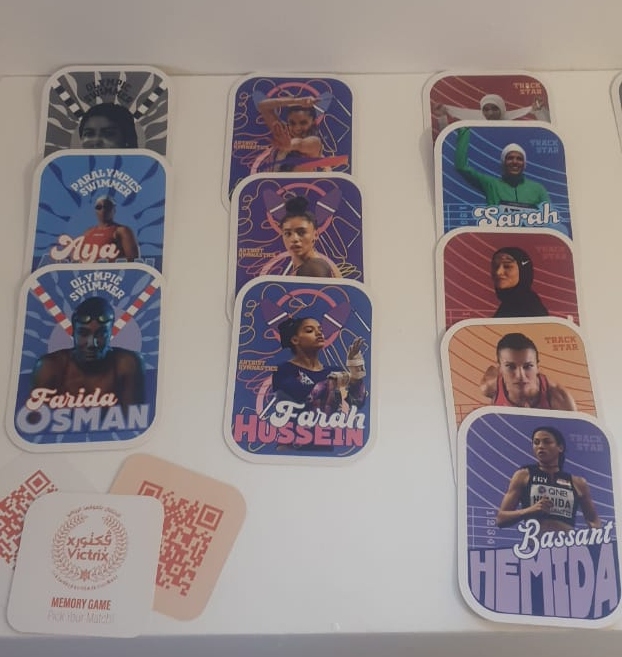 Cards showcasing female athletes spread over a table