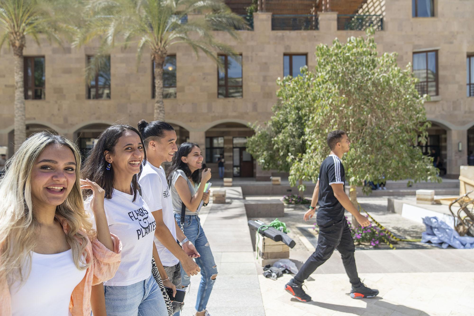 Group of students walking together and laughing