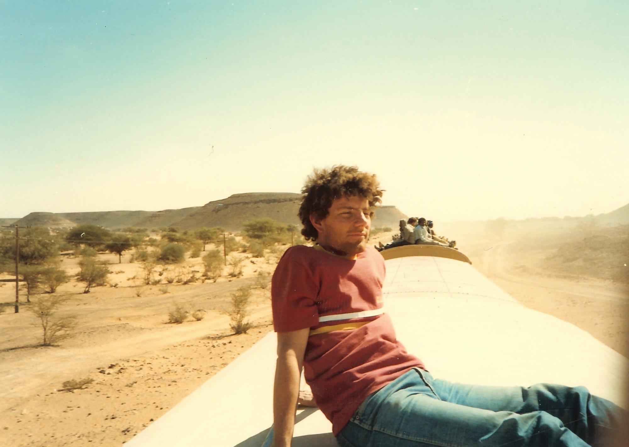 Nicholas Kristof on a train in northern Sudan during AUC's winter break