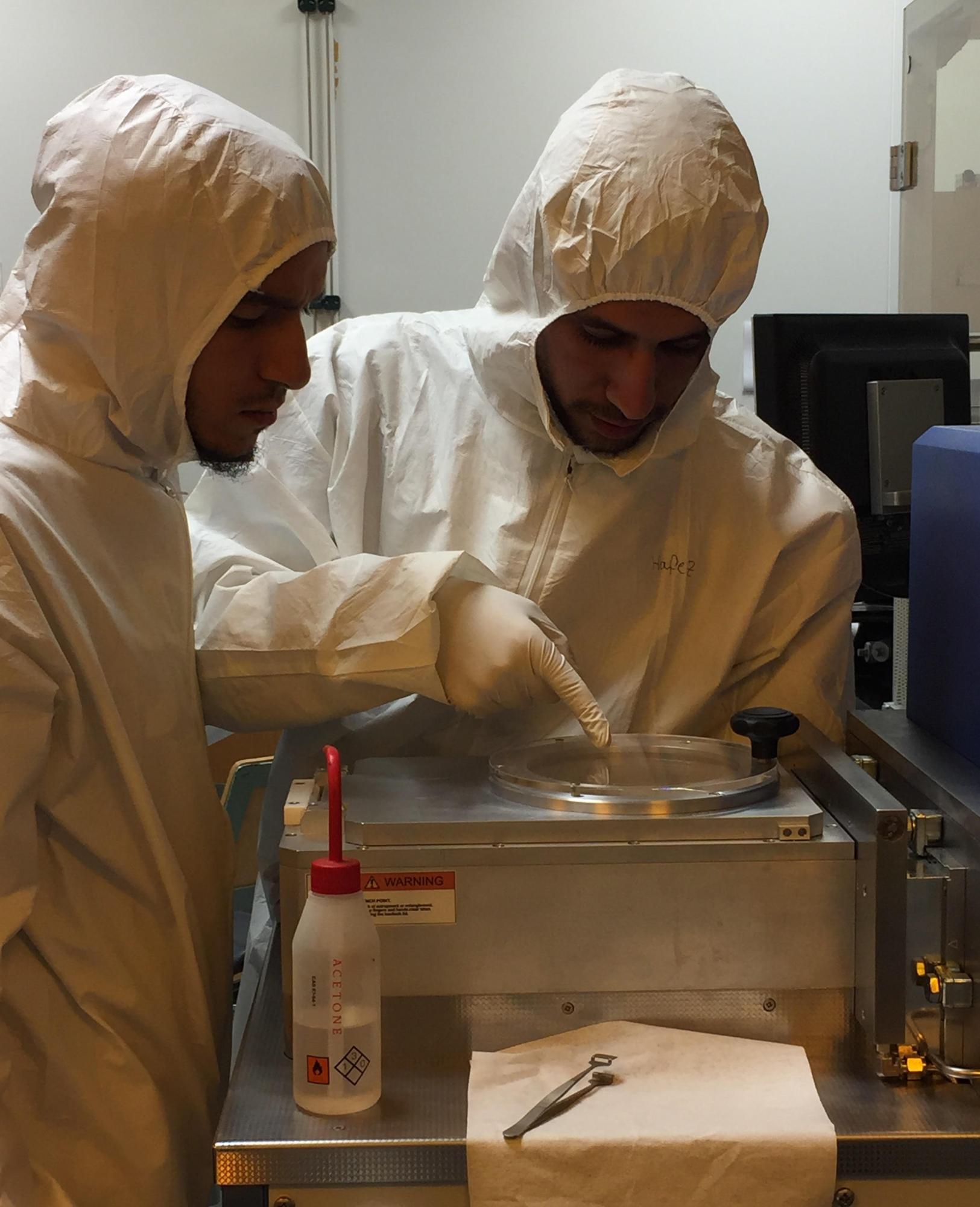 Graduate students Ahmad Amer and Ahmed Hafez work in the lab as part of Nageh Allam's team researching solar cell technology with their MIT counterparts