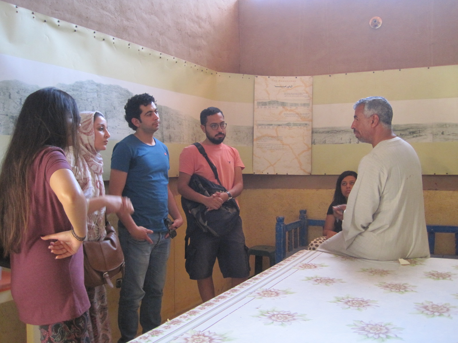 Abdu Daramalli speaks to students with the Living Villages exhibition around them which had been put up just for that day.