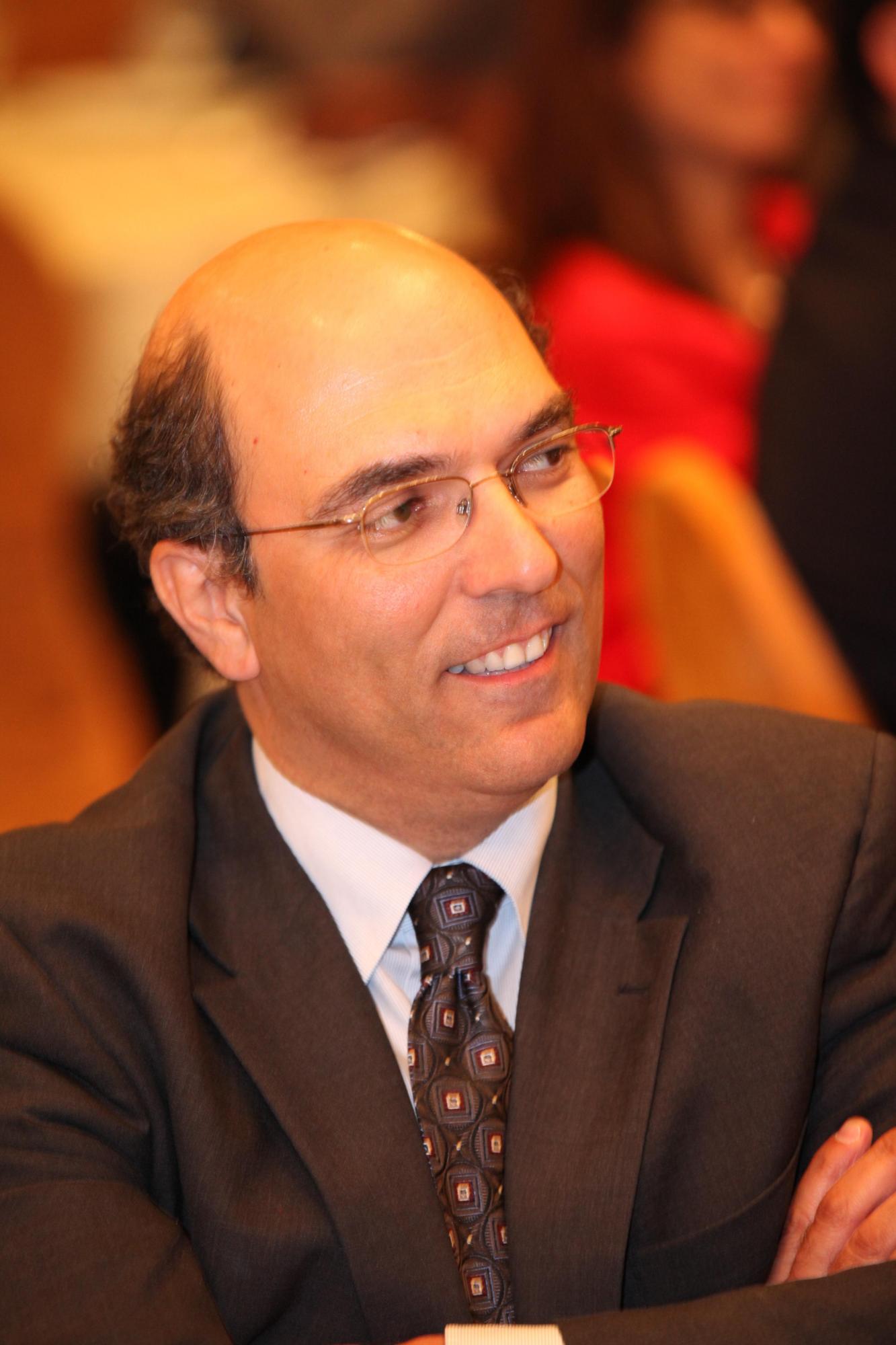 headshot of a man smiling