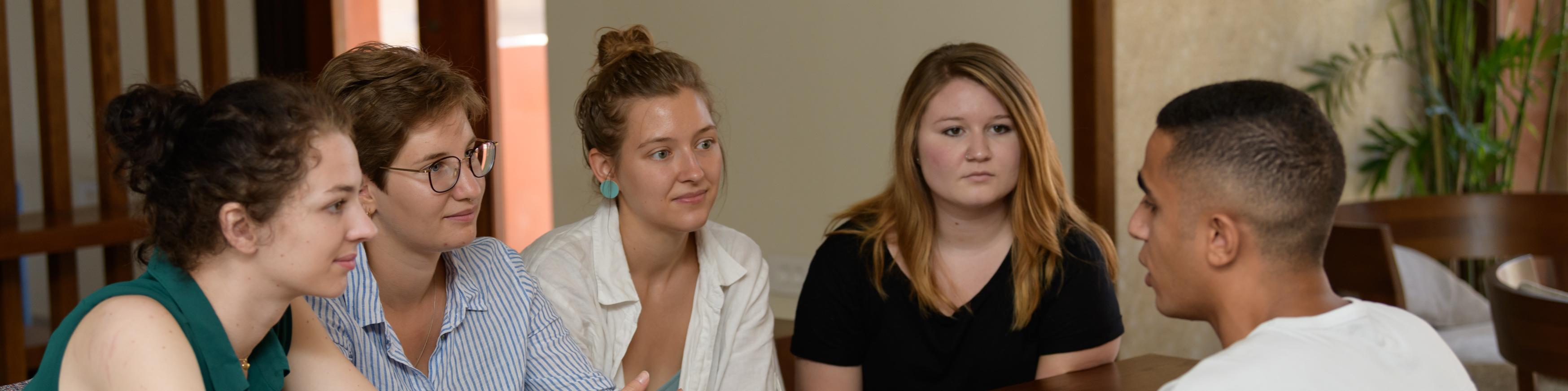 AUC Students talking on campus. 