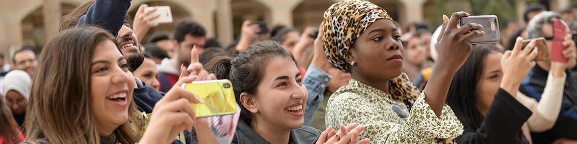 AUC international students taking pictures while on campus. 