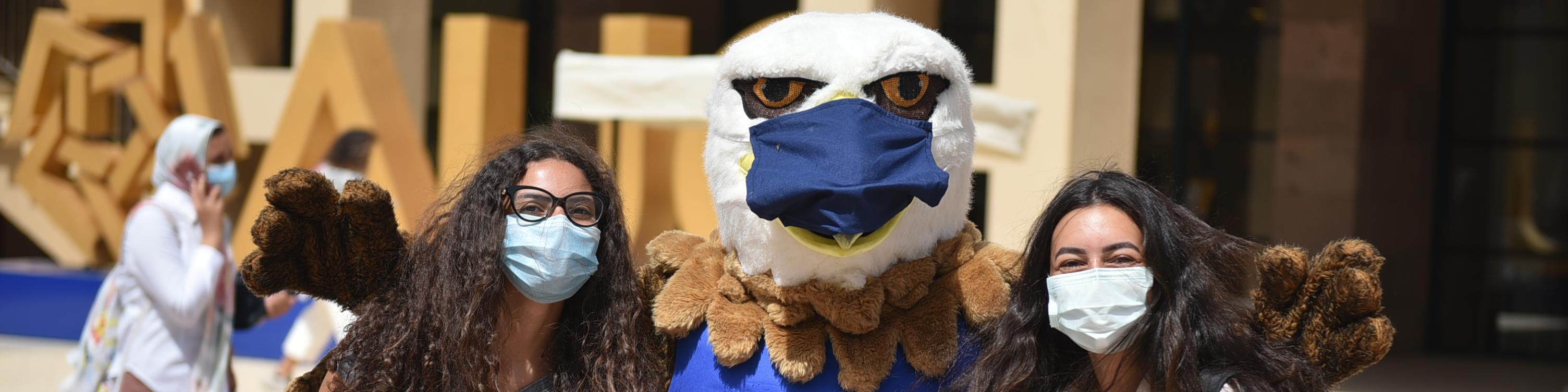 AUC Masked Mascot with Students