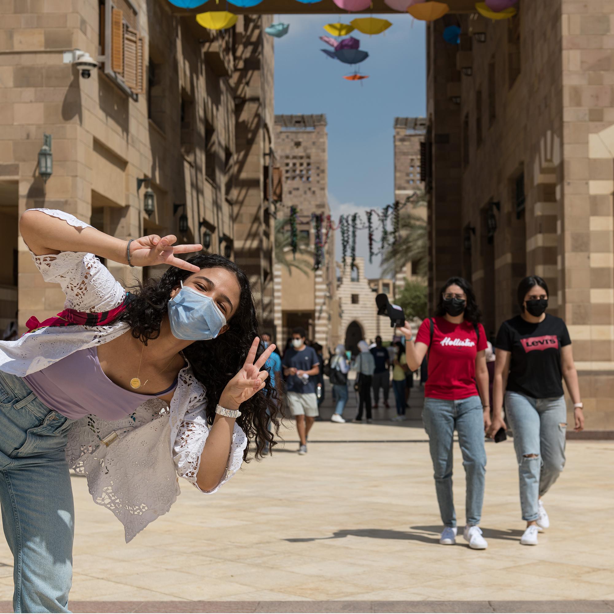 auc-students-campus-girl-laughing