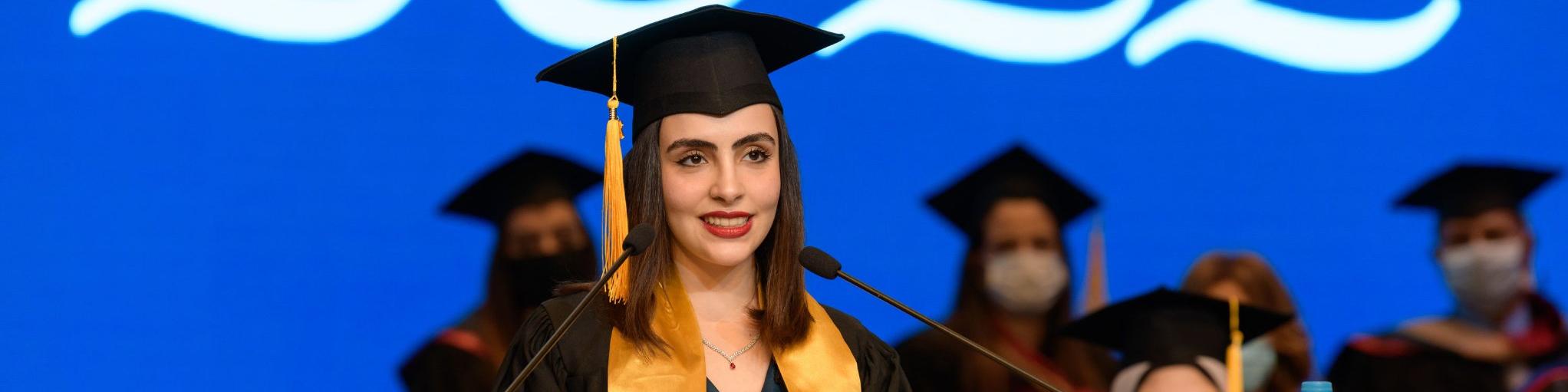 Student giving a speech at her commencement