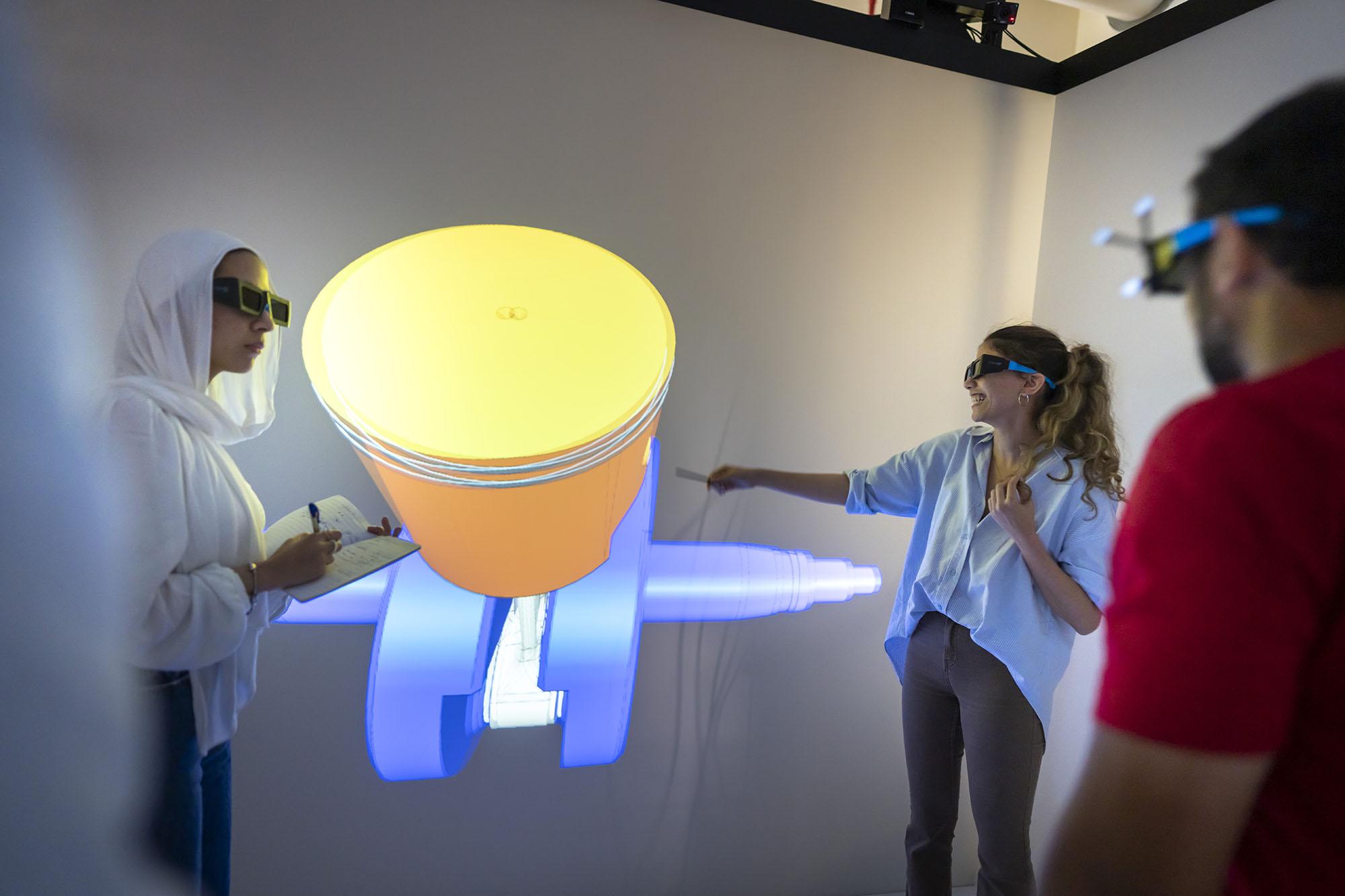 girls and boys wearing virtual glasses in front of a big screen