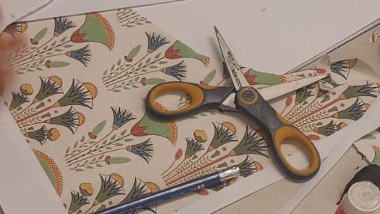 Picture of ancient Egyptian lotus flowers and scissors 
