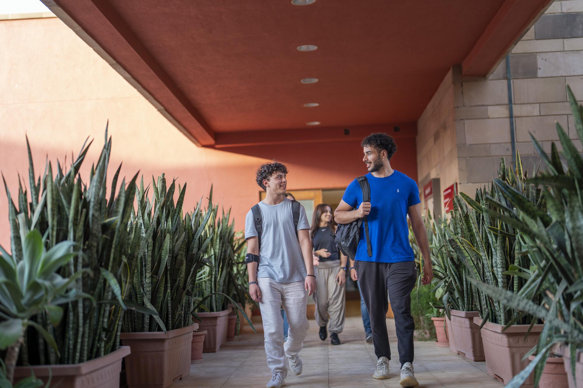 students walking towards classroom for class