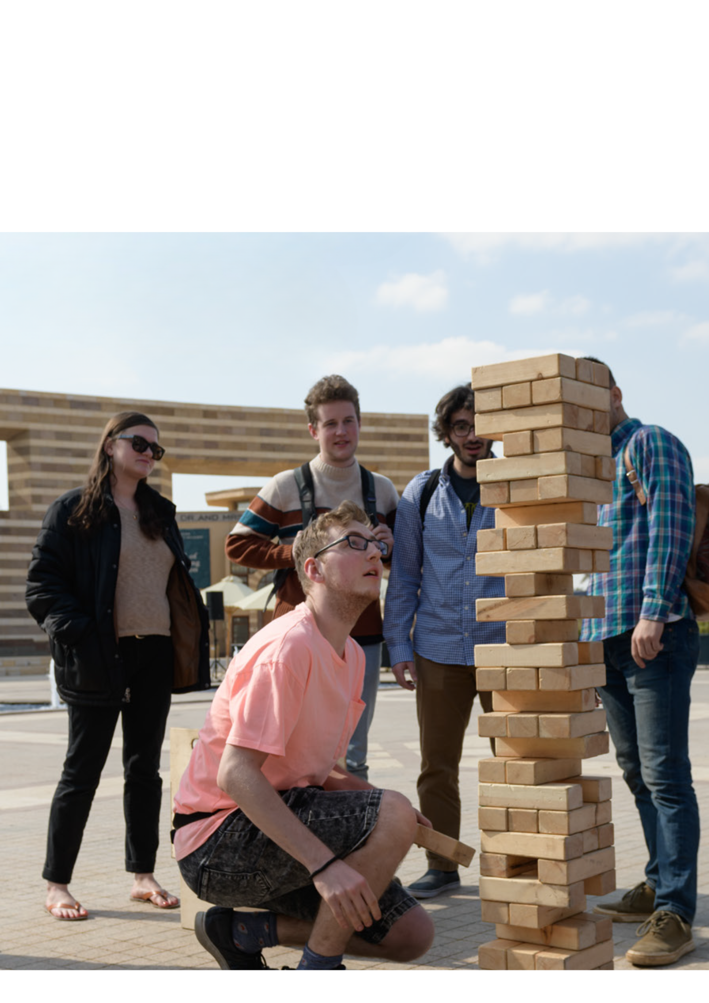 students exploring bricks while on a summer camp on campus