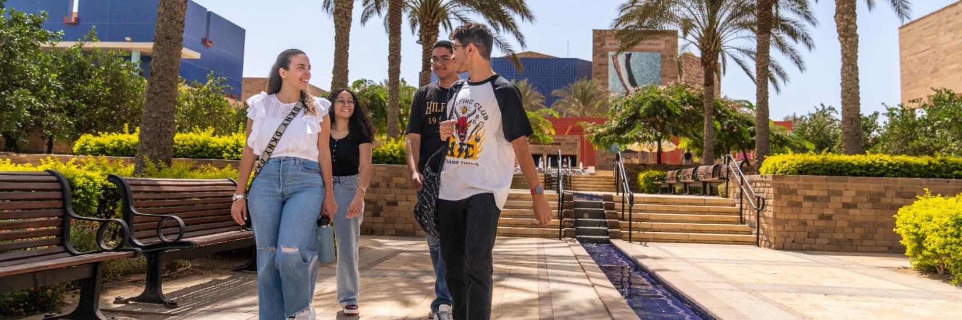 Students walking near the water at the CVC