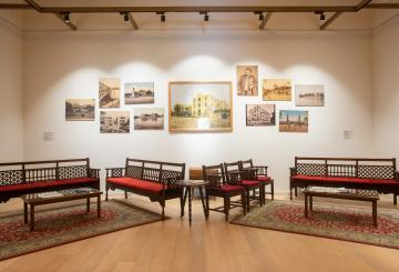 Seating area and paintings in a room