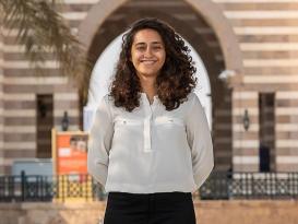 Girl with curly hair smiling