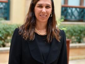 Girl wearing black suit smiling