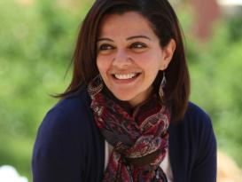 Lady wearing a scarf smiling