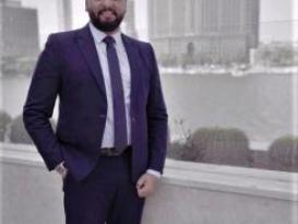 Man with suit and tie smiling