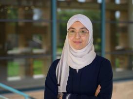 A headshot of a veiled woman