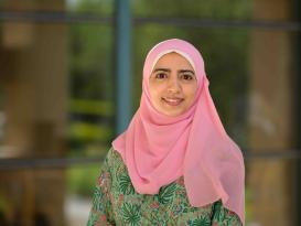 A headshot of a veiled woman