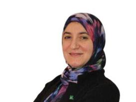 A veiled woman is smiling