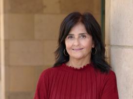 Maysa Ayoub leaning against a concrete wall