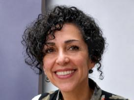 Nidaa wearing a floral pattern suit jacket