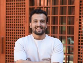 A man standing and smiling