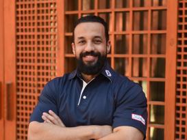 A man standing and smiling
