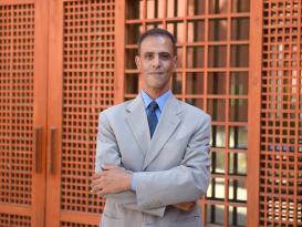 A man standing and smiling