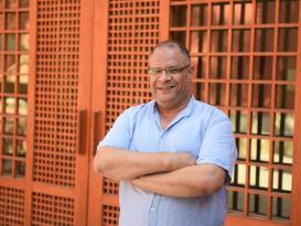 A man standing and smiling