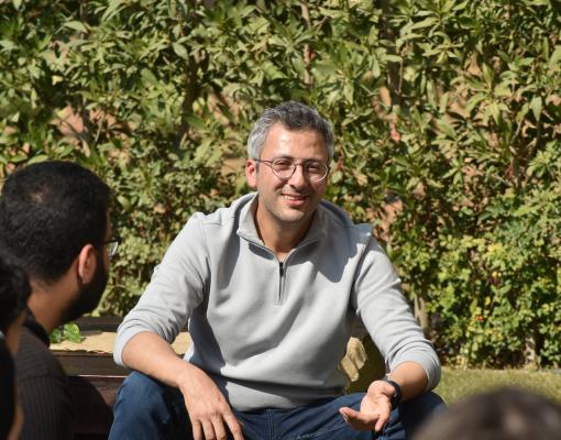 Ahmed Gaballah talking to students
