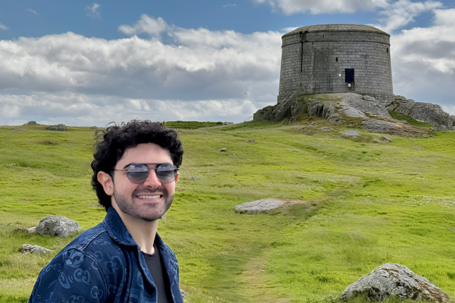 A man standing near a monument 