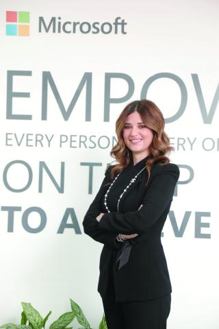 Woman standing cross armed and smiling