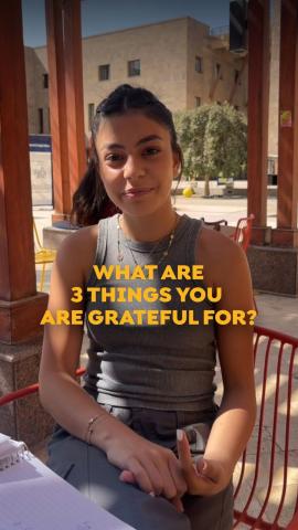 A girls is sitting on a chair, Text reads "What Are 3 Things You Are Grateful For?"