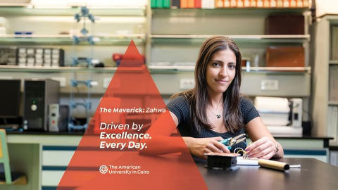 A girl sitting in a lab, text reads " Zahwa The Maverick. Driven by Excellence Every Day. The American University in Cairo"