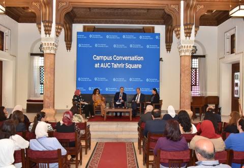People sitting in a panel. Text: Campus Conversation at AUC Tahrir Square