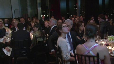 People sitting in front of tables having dinner