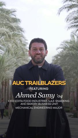 A man is standing and smiling. Text: AUc Trailblazers featuring Ahmed Samy ’04, CEO of Edita Snacking and Bakery