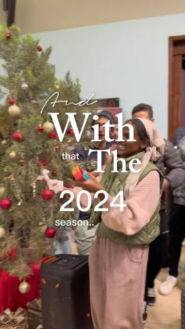 Males and females decorating a Christmas tree. Text: And with that the 2024 season