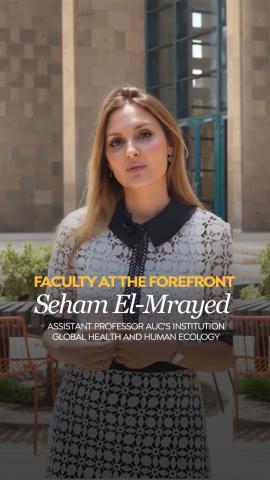 A woman is standing in an outdoor area. Text: Faculty at the Forefront Seham Elmrayed, Assistant Professor at AUC’s Institute of Global Health and Human Ecology (IGHHE)