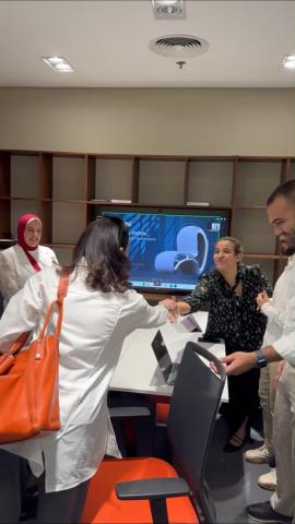 People smiling and shaking hands 