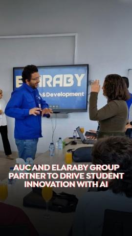 A male and a female are standing and talking. Text: AUC and AlAraby Group Partner to Drive Student Innovation with AI