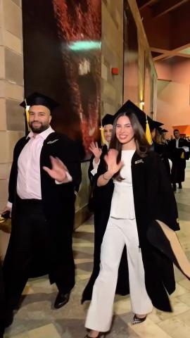 Males and females wearing graduation caps and gowns