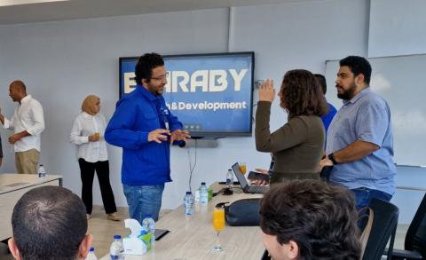 People standing and others are sitting. They are talking