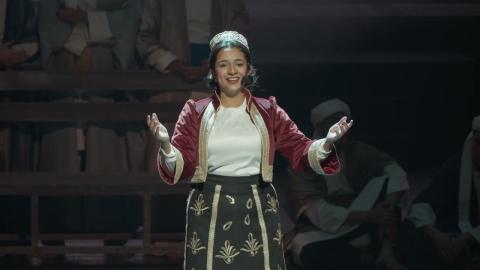 A woman is performing on stage