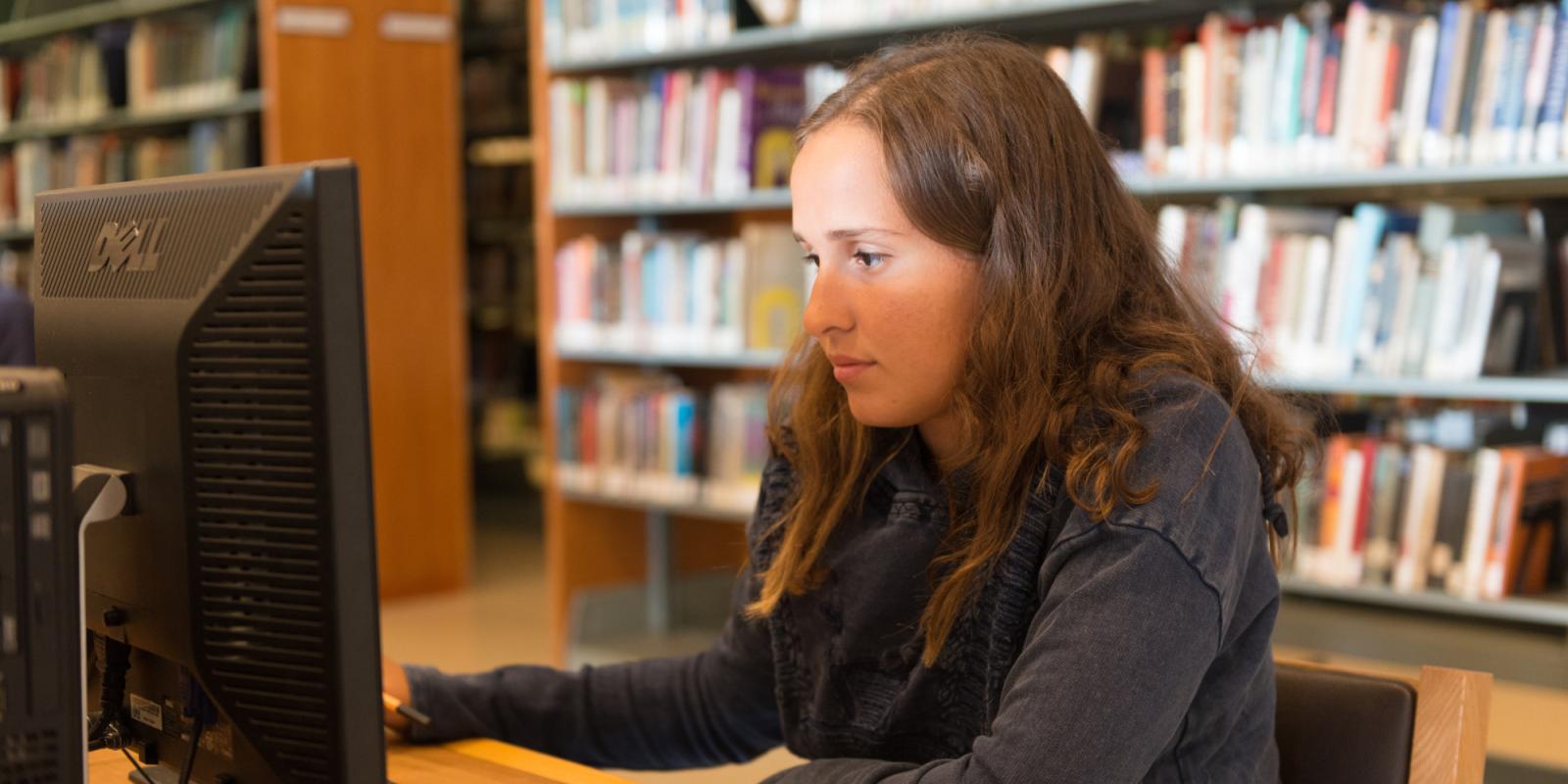 student in library