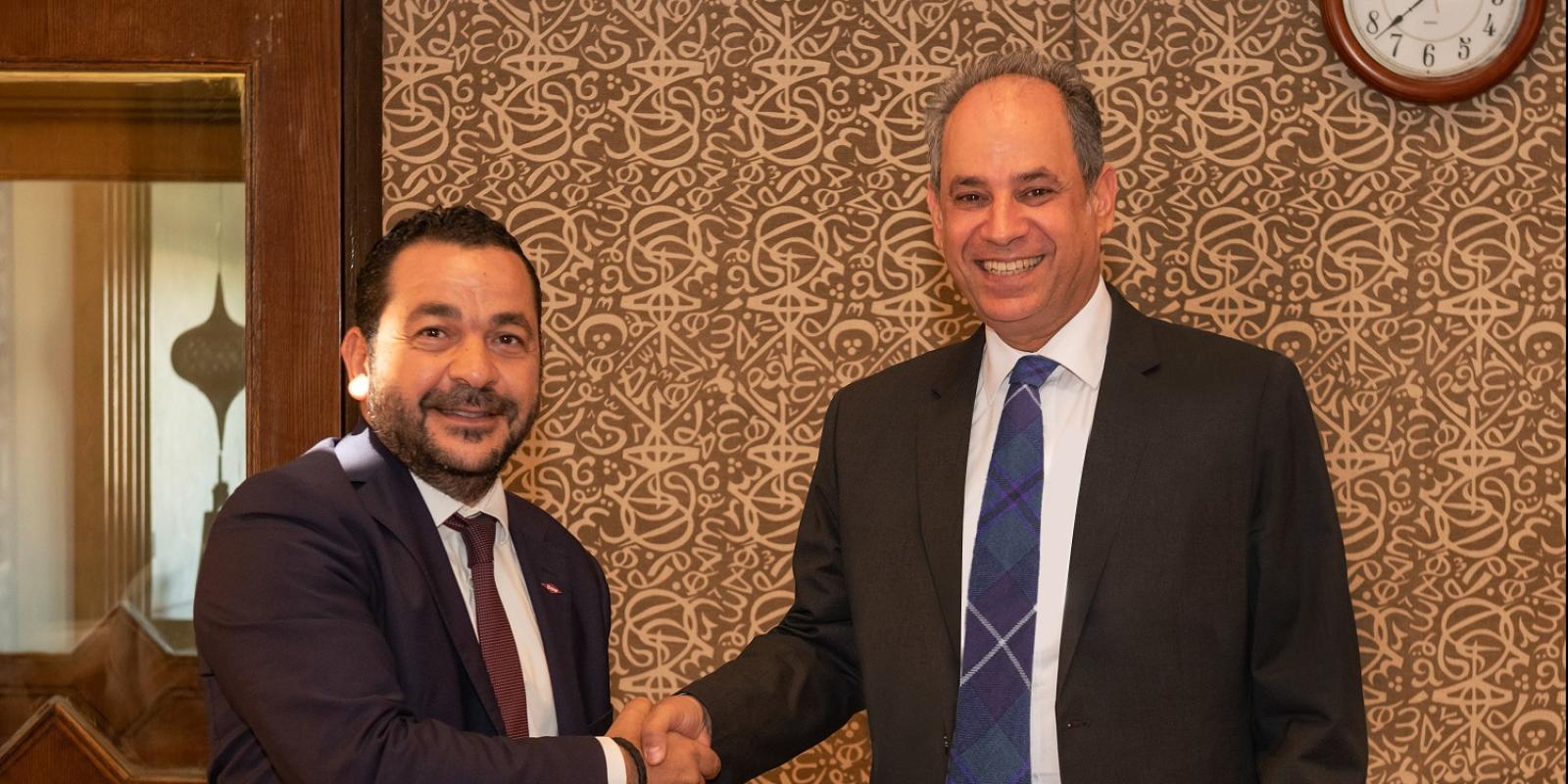 AUC Provost Ehab Abdel-Rahman and Dow Egypt's Country Manager Momen Adel sign the AUC-Dow research and development partnership