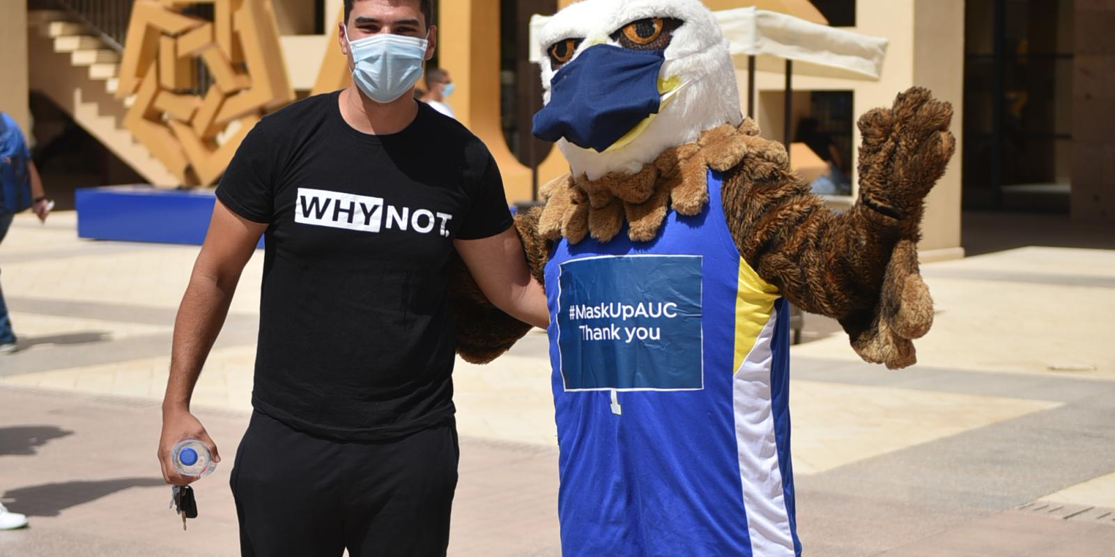 AUC Masked Mascot with Student