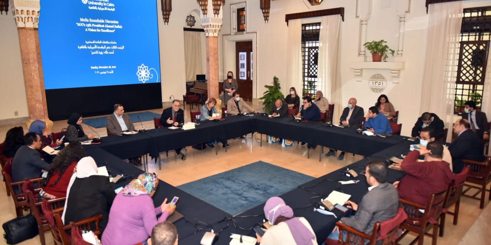 President Ahmad Dallal is speaking to participants during the event in AUC Tahrir Square